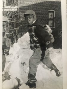 An image of the author, Kermit Frazier as a child. He is standing in the snow. c. 1950s, Washington DC area.